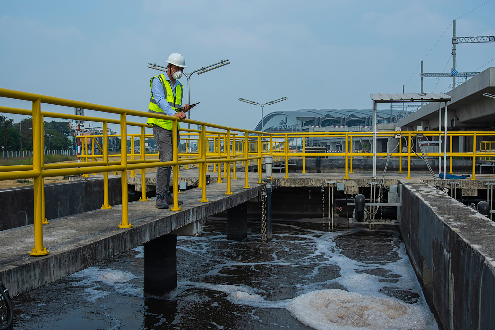 workers at work on Wastewater treatment plant. Wastewater treat